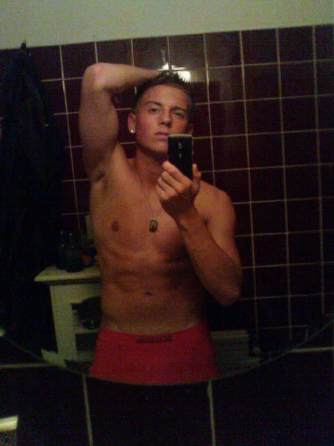 Anton Hysen shirtless and posing with iPhone