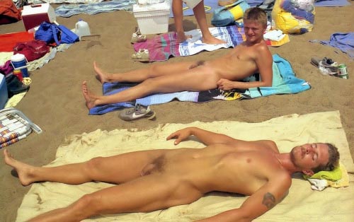 two hot men sunbathing naked